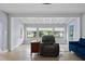 Comfortable living room with coffered ceilings and large windows providing ample natural light at 4420 Conway Gardens Rd, Orlando, FL 32806