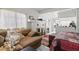 Cozy living area featuring a decorative fireplace and open layout to the kitchen at 4420 Conway Gardens Rd, Orlando, FL 32806
