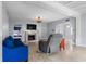 Spacious living room features a fireplace, a blue sofa and tile flooring at 4420 Conway Gardens Rd, Orlando, FL 32806