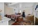 Living area with bed, a couch, and ample lighting. A chest sits at the foot of the bed at 4420 Conway Gardens Rd, Orlando, FL 32806