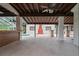Spacious outdoor patio featuring a ceiling fan, bar, and views of the pool area at 4420 Conway Gardens Rd, Orlando, FL 32806