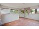 Light-filled sun room with tile floor offers a relaxing atmosphere at 4420 Conway Gardens Rd, Orlando, FL 32806