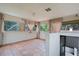 The spacious sunroom boasts terra cotta tile floors, natural light, and staircase to the basement at 4420 Conway Gardens Rd, Orlando, FL 32806