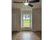 A bedroom with a window between two closets at 470 Sunset Rd, Deltona, FL 32725