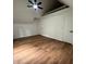 Bedroom with hardwood floors and a vaulted ceiling with railing and ceiling fan at 470 Sunset Rd, Deltona, FL 32725