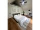 Bright bedroom with white walls, wood floor and a ceiling fan at 470 Sunset Rd, Deltona, FL 32725