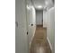 Hallway with white walls and doors leading to other rooms in the house at 470 Sunset Rd, Deltona, FL 32725