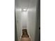 Stairway with white walls leading down to the lower level at 470 Sunset Rd, Deltona, FL 32725