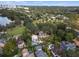Stunning aerial view of homes surrounded by lush greenery and a serene lake, creating a peaceful neighborhood at 522 Cherokee Dr, Orlando, FL 32801