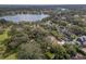 Breathtaking aerial view featuring homes nestled among mature trees and a picturesque lake at 522 Cherokee Dr, Orlando, FL 32801