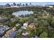 Panoramic aerial view showcasing the neighborhood, nearby lake, and the city skyline in the backdrop at 522 Cherokee Dr, Orlando, FL 32801