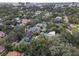 Aerial view showcasing the neighborhood, lush tree coverage, and providing a glimpse of the surrounding environment at 522 Cherokee Dr, Orlando, FL 32801