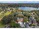 Scenic aerial shot showcasing homes near a tranquil lake and tree-lined streets in a desirable location at 522 Cherokee Dr, Orlando, FL 32801