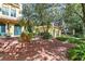 Expansive backyard with mature landscaping, brick paved patio, perfect for relaxation and outdoor enjoyment at 522 Cherokee Dr, Orlando, FL 32801