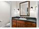 Elegant bathroom featuring a vanity with dark countertops and a stylish mirror, providing a refined space at 522 Cherokee Dr, Orlando, FL 32801