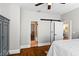 Bedroom showcasing hardwood floors, with multiple entries to other rooms at 522 Cherokee Dr, Orlando, FL 32801