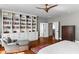 Bedroom featuring a custom bookcase, hardwood floors, and french doors at 522 Cherokee Dr, Orlando, FL 32801