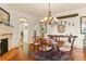 Formal dining room featuring hardwood floors, a classic chandelier, and elegant furnishings for sophisticated dining at 522 Cherokee Dr, Orlando, FL 32801
