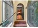 Arched entryway leading to interior, showcasing wood beams and kitchen details at 522 Cherokee Dr, Orlando, FL 32801