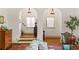 Charming interior view with hardwood floors, arched entryways, and a staircase, creating a warm atmosphere at 522 Cherokee Dr, Orlando, FL 32801