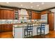 Gourmet kitchen with custom wood cabinets, granite countertops, and stainless steel appliances at 522 Cherokee Dr, Orlando, FL 32801