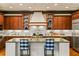 Spacious kitchen with custom cabinets, a large island, and stainless steel appliances at 522 Cherokee Dr, Orlando, FL 32801