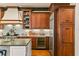 Kitchen view featuring custom wood cabinets and stainless steel appliances at 522 Cherokee Dr, Orlando, FL 32801
