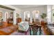 Cozy living room showcasing hardwood floors, arched entryways, and elegant furniture arrangement at 522 Cherokee Dr, Orlando, FL 32801