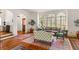 Elegant living room featuring hardwood floors, arched doorways, and large windows for a bright, airy feel at 522 Cherokee Dr, Orlando, FL 32801
