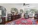 Well-lit home office with hardwood floors, arched windows and custom cabinetry at 522 Cherokee Dr, Orlando, FL 32801