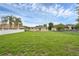 Expansive backyard with lush green grass, surrounded by fencing for added privacy at 663 Romano Ave, Orlando, FL 32807