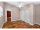 Bedroom with tile floor, large closet, and neutral colored walls at 663 Romano Ave, Orlando, FL 32807