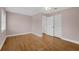 Bedroom with wood floors and closet space at 663 Romano Ave, Orlando, FL 32807