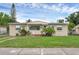 Charming single-story home features a well-maintained lawn and established landscaping at 663 Romano Ave, Orlando, FL 32807