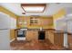 Cozy kitchen with tile flooring, ample cabinet space, and modern appliances at 663 Romano Ave, Orlando, FL 32807