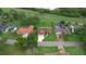 Aerial view of a home, showcasing its well-maintained lawn, driveway, and surrounding neighborhood landscape at 6766 Edgeworth Dr, Orlando, FL 32819