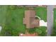 An overhead perspective of the home, showcasing its roof, landscaped yard, and proximity to the street at 6766 Edgeworth Dr, Orlando, FL 32819
