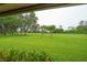 Expansive backyard with mature trees and lush green lawn, great for outdoor activities at 6766 Edgeworth Dr, Orlando, FL 32819