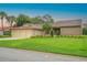 Charming single-story home featuring a three-car garage and lush, green lawn at 6766 Edgeworth Dr, Orlando, FL 32819