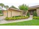 Charming single-story home with a three-car garage and beautifully landscaped front yard at 6766 Edgeworth Dr, Orlando, FL 32819