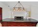 Kitchen island with granite counters and custom cabinetry at 6766 Edgeworth Dr, Orlando, FL 32819