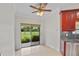 Kitchen with sliding glass doors to outdoor space, stainless appliances at 6766 Edgeworth Dr, Orlando, FL 32819