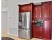 Kitchen with stainless steel refrigerator and custom cabinetry at 6766 Edgeworth Dr, Orlando, FL 32819