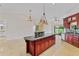 Open floor plan with view of the kitchen, island, and appliances at 6766 Edgeworth Dr, Orlando, FL 32819