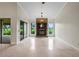 Open living room featuring a brick fireplace, recessed lighting, and seamless access to the outdoors at 6766 Edgeworth Dr, Orlando, FL 32819