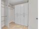 Spacious walk-in closet with custom shelving and ample storage space at 6766 Edgeworth Dr, Orlando, FL 32819