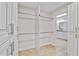 Large walk-in closet providing custom storage, shelving, and abundant space at 6766 Edgeworth Dr, Orlando, FL 32819