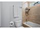 Bathroom tub featuring white tile, glass block and chrome shower head at 701 Little Hampton Ln, Gotha, FL 34734