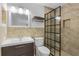 Modern bathroom featuring a tiled shower, vanity, and sleek fixtures, exuding comfort and style at 701 Little Hampton Ln, Gotha, FL 34734