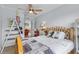 Cozy baseball themed bedroom featuring a bed, sports decor, and a ceiling fan for comfort at 701 Little Hampton Ln, Gotha, FL 34734